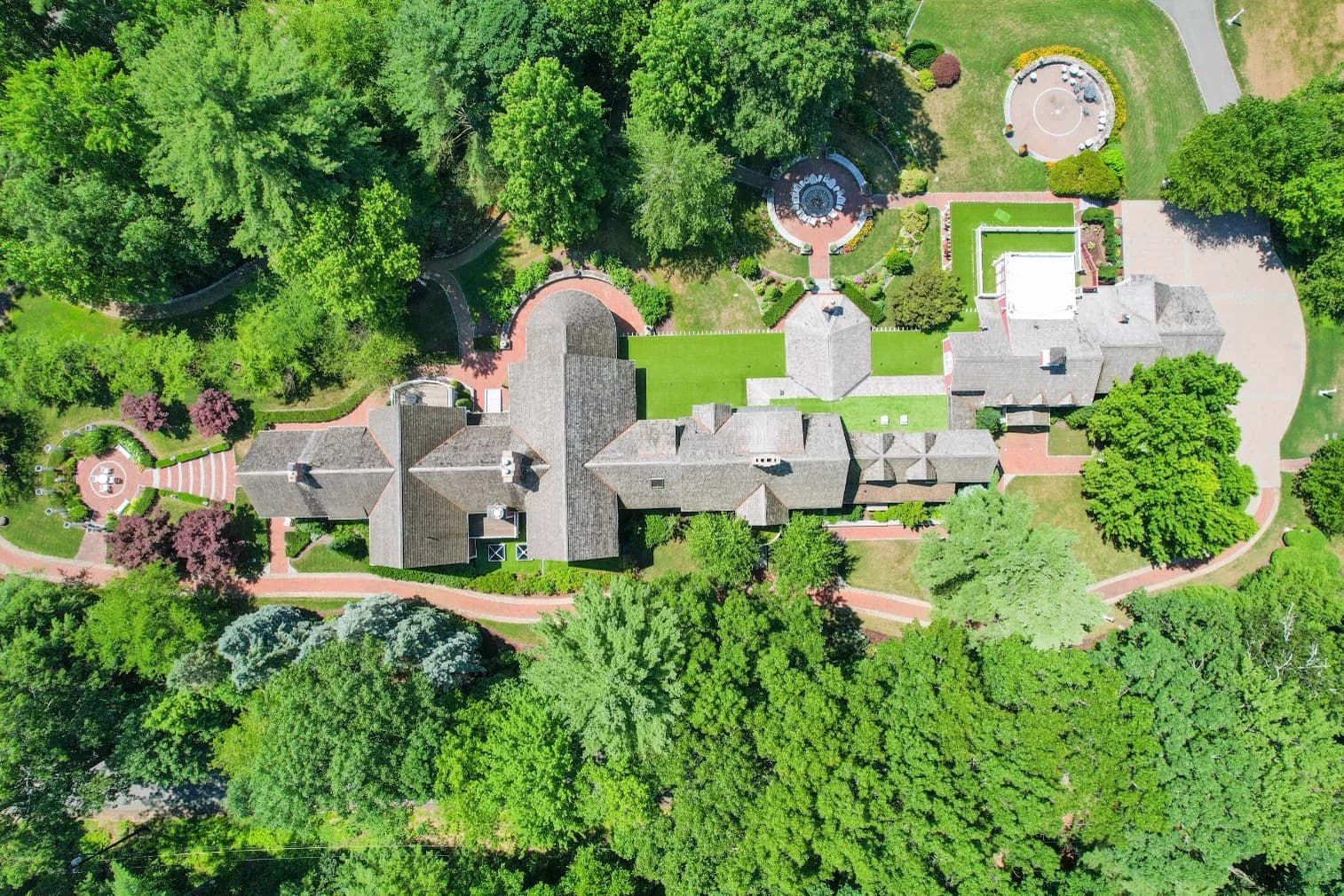 The gardens, fountain courtyard, and drives of the estate from above
