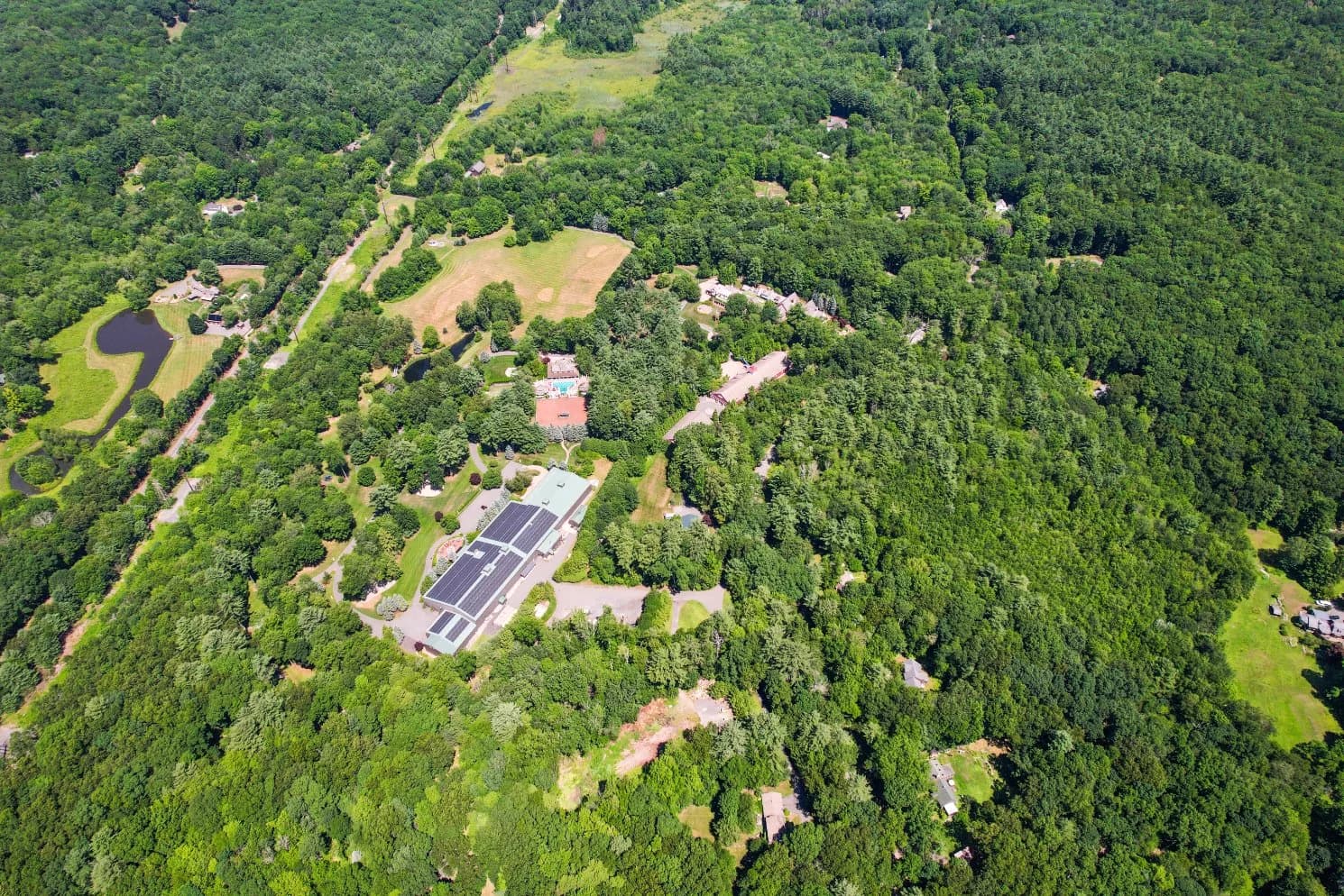 The meadow, ponds, and walking trails of the estate from above