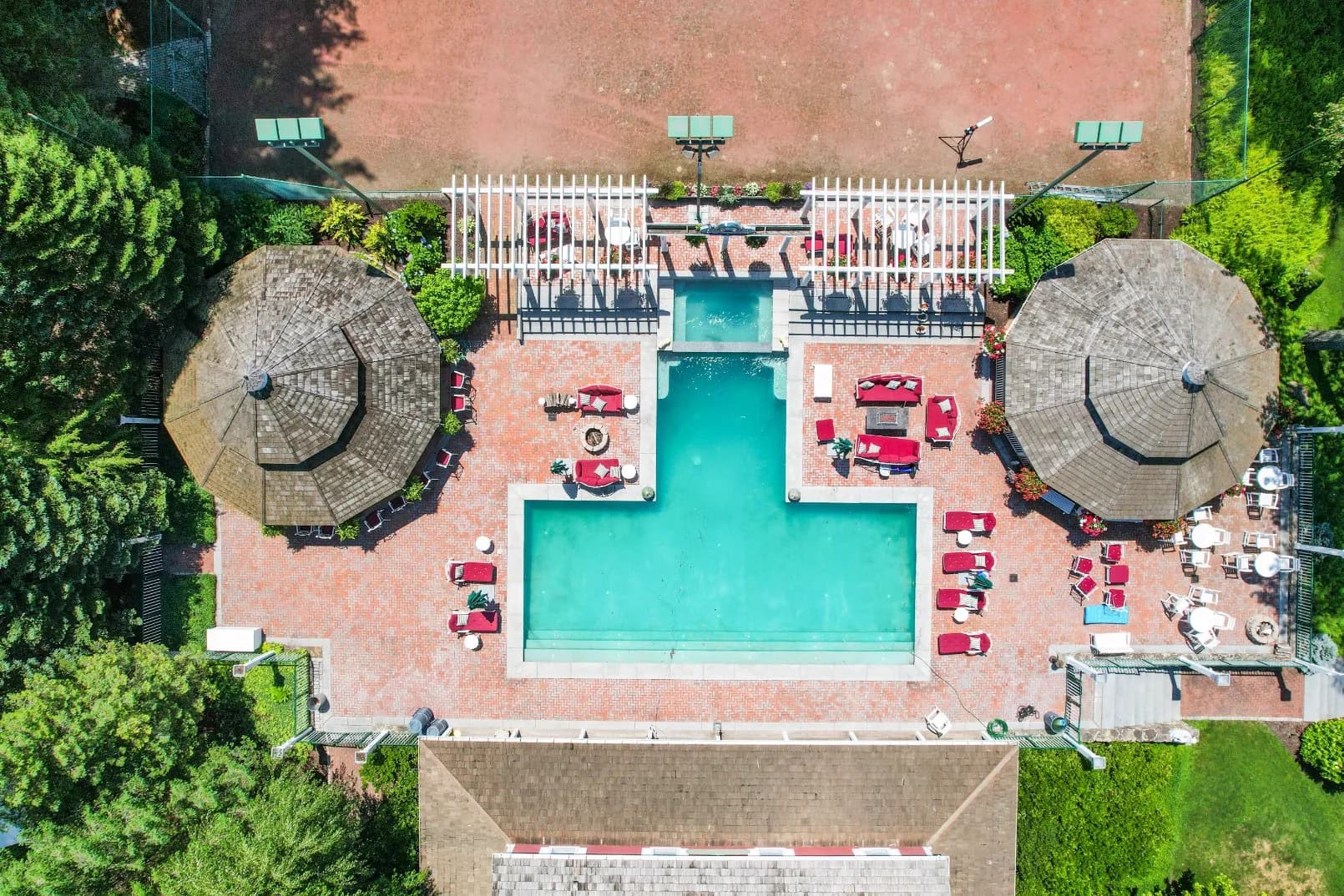 The T-shaped outdoor pool behind The Clubhouse, from above