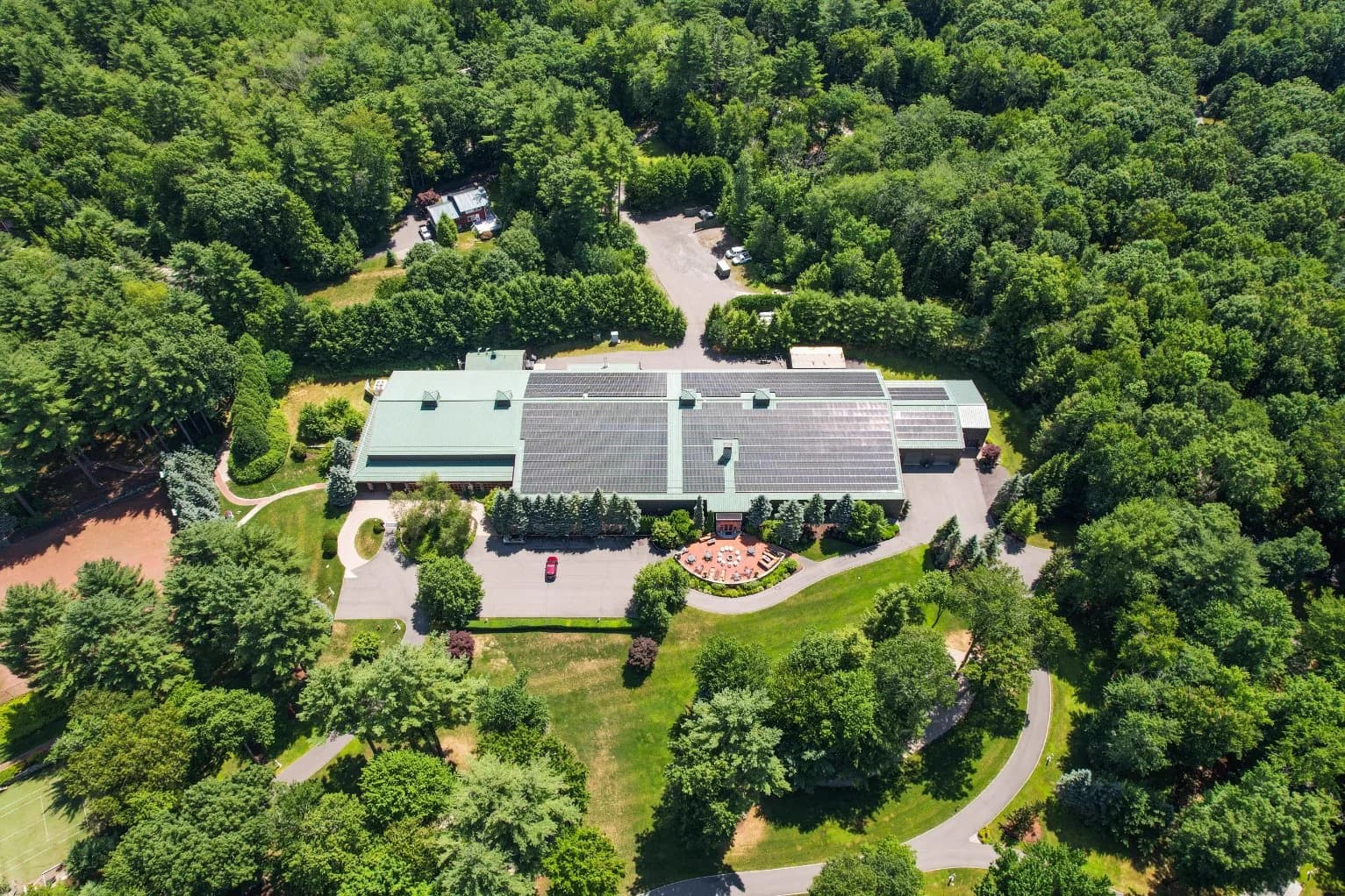 The outdoor tennis court beside The Spa, from above
