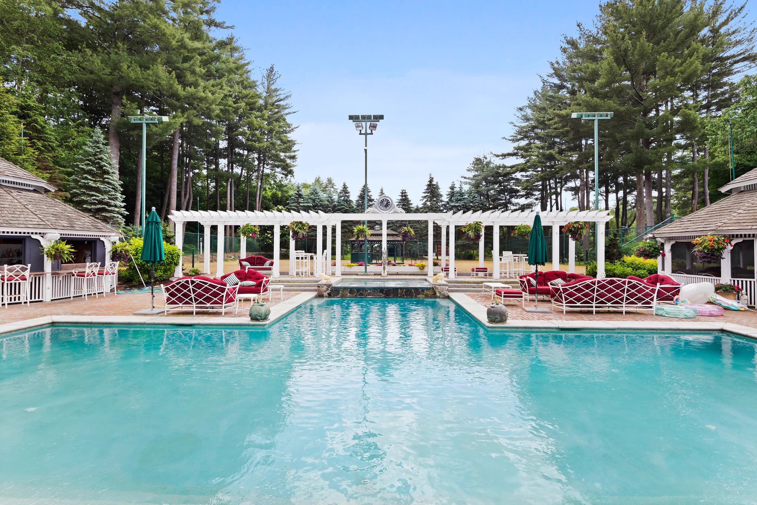The pergola walk between the outdoor pool and the courts