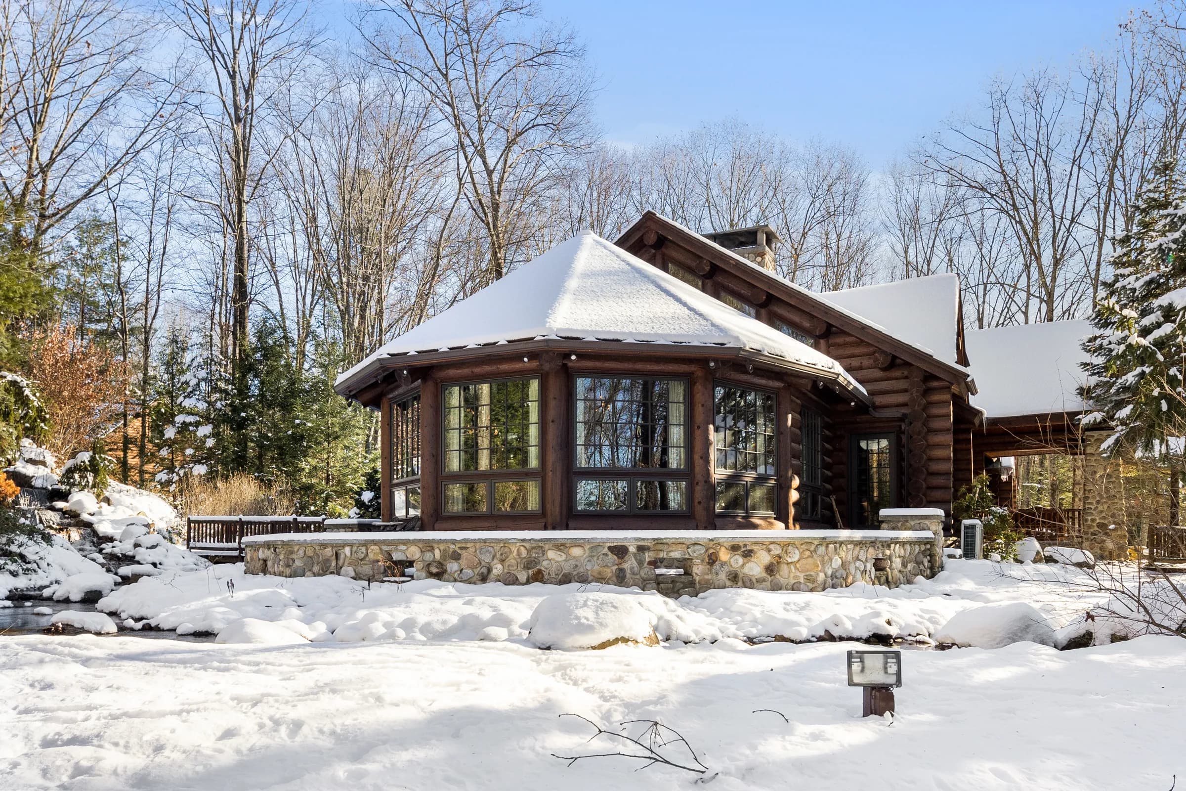 The octagonal rotunda wing of The Lodge ringed by snow-laden pines