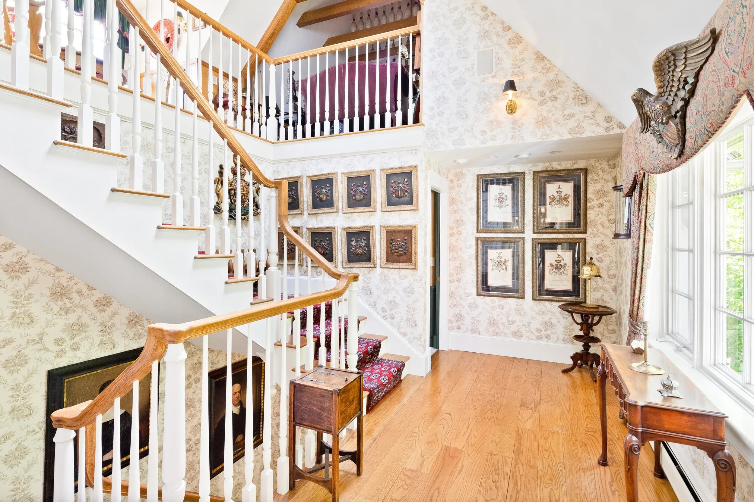 The stairwell gallery lined with heraldic crests